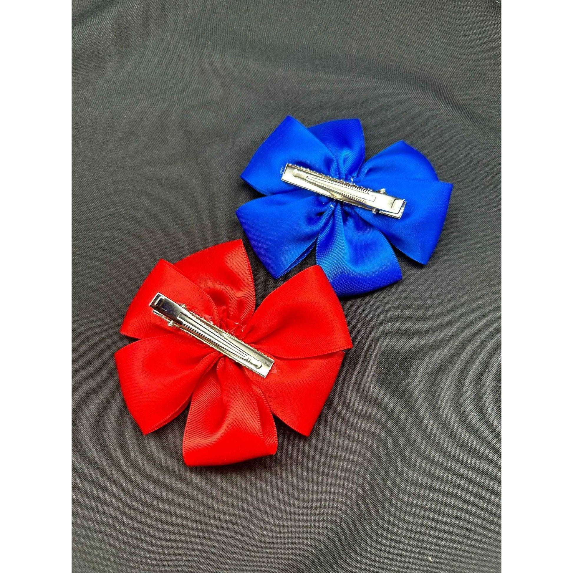 a pair of red scissors on a blue cloth 