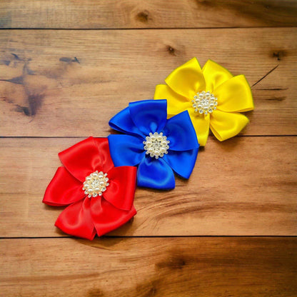 a vase filled with blue and yellow flowers 