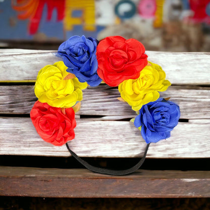 a vase of flowers sitting on a wooden bench 