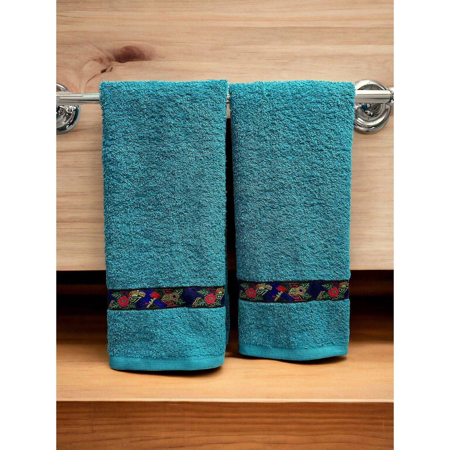 a close up of a blue towel on a shelf 